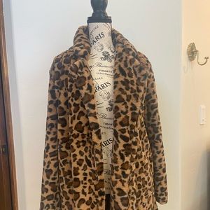 Faux fur leopard print jacket. Size med. Fluffy with pockets. Mid thigh length